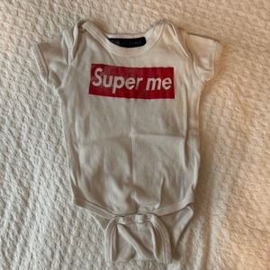 White Baby Onesie with Red "Super me" Graphic